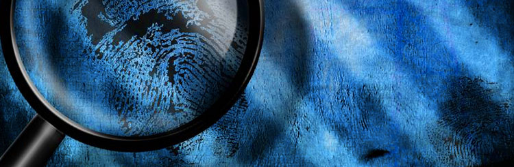 Magnifying glass focussed on a blue finger print